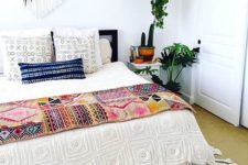 30 a crochet fringe bedspread, printed pillow covers and a bold boho throw