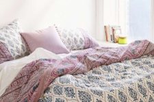 31 blue, mauve and white printed bedding and tassel pillows