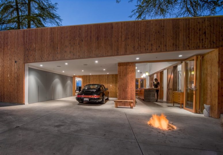 house with a rooftop terrace The covered parking area and a roofed terrace serve as transitional spaces between indoor and outdoor