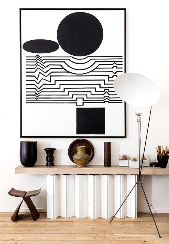 light floors design The designer opted for light-colored wooden floors, white walls to create a great backdrop for his art collections, which added character to the spaces