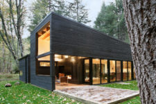 02 The exterior is clad with Western red cedar with a dark finish, there are a lot of windows and skylights