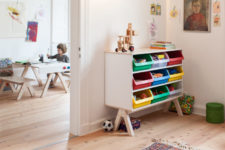 03 Creative and comfy in using shelving unit with plastic crates that can be removed and used throughout the room
