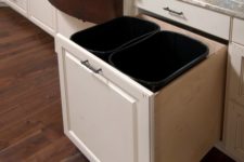 03 a large pull out drawer with two trash cans will fit your needs