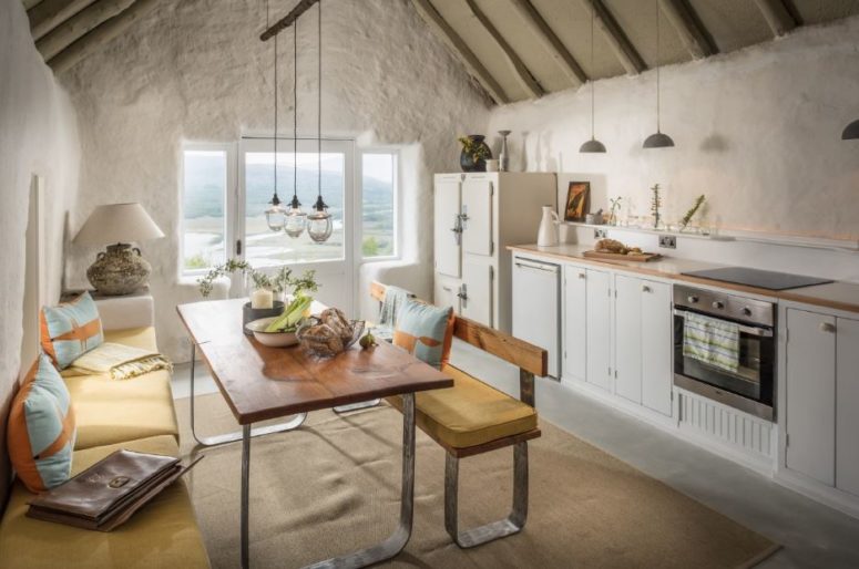 The kitchen is a line of cabinets by the wall, and the dining zone offers amazing views on the landscape The kitchen is a line of cabinets by the wall, and the dining zone offers amazing views on the landscape