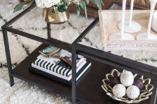 04 a combo of black framed glass tables with a dark stained lower top and a glass tabletop