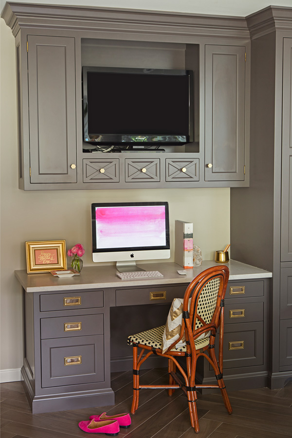 The home office is visually divided from the kitchen with a different shade of cabinets and more traditional design The home office is visually divided from the kitchen with a different shade of cabinets and more traditional design