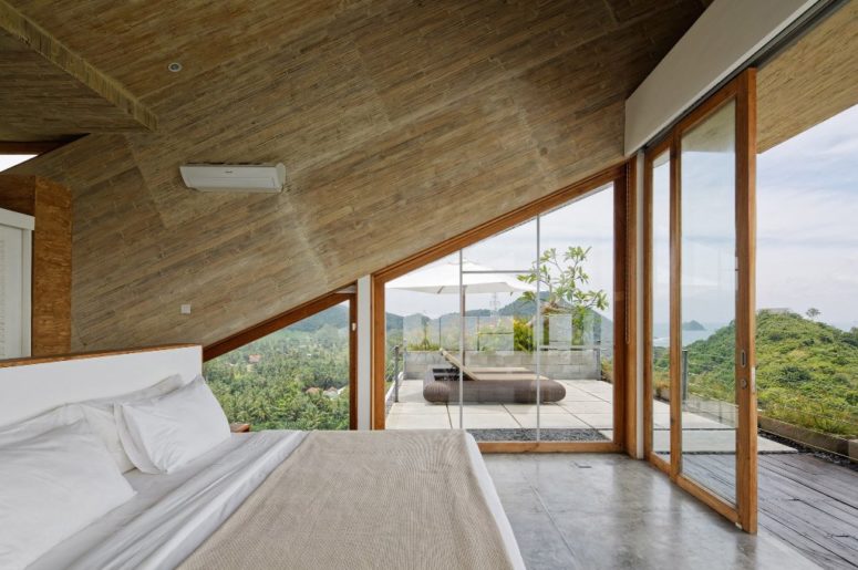 The master bedroom is very minimalist and is focused around the gorgeous views, almost all the walls are glazed