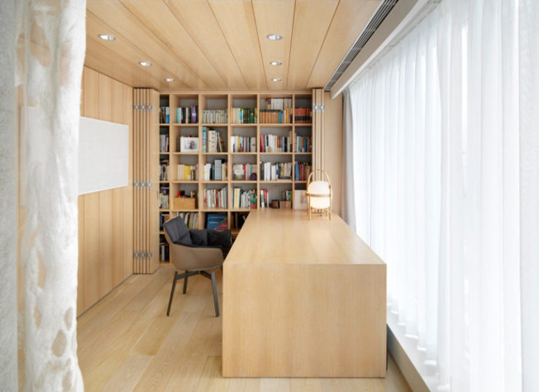 Open the panels and you'll see a lot of bookshelves, smartly hidden inside