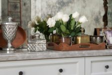 06 a faded mirror kitchen backsplash is a chic and maintainable idea
