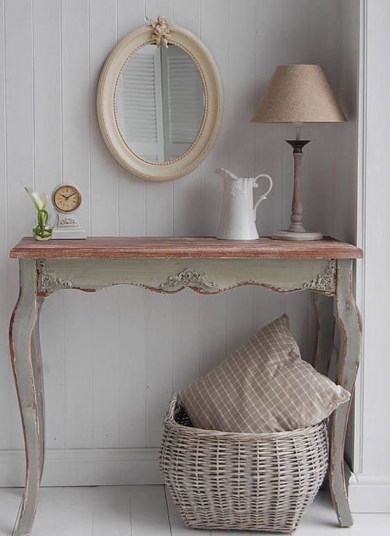 a tiny antique desk as an entrance table for a rustic vintage space