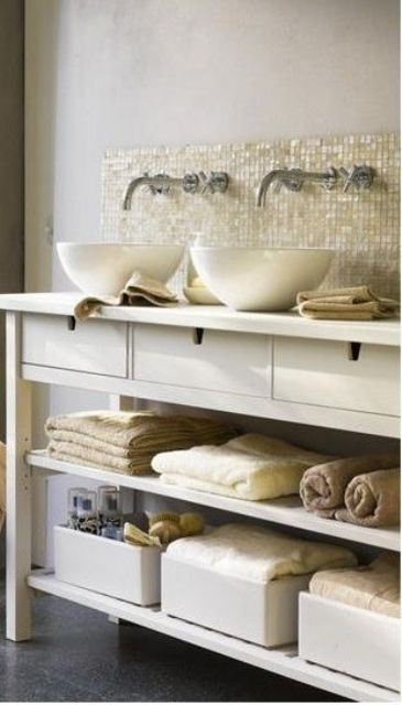 mother of pearl tiles add a natural seaside feel to this neutral bathroom