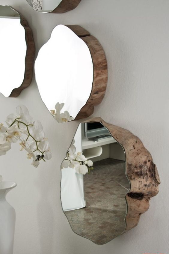 rough wood pieces with matching mirrors on top look really unique, such an arrangement will blow everybody's mind