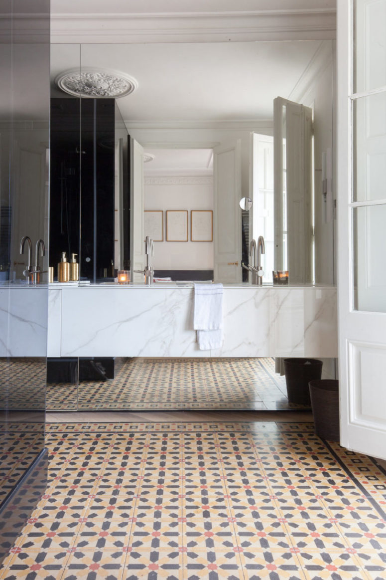 The bathroom is clad with white marble, which makes it super luxurious