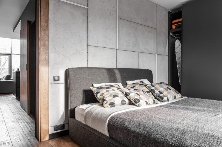 concrete bedroom design The bedroom is simple and functional, and concrete panels are made cozier with an upholstered bed