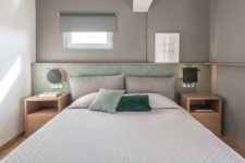 08 The master bedroom is done in grey and mint, with additions of natural wood