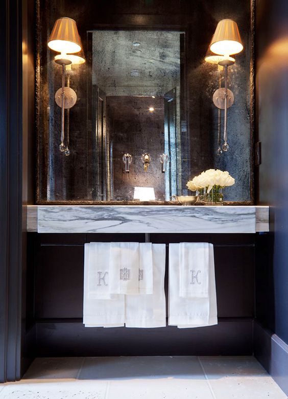 a faded mirror instead of a usual one is a great way to add chic to your bathroom