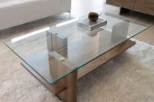 08 a modern zen coffee table with a wooden base and a glass tabletop, vertical stilts add eye-catchiness