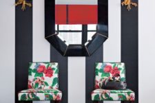08 an art deco entryway in black and white is spruced up with bold green and red floral print chairs