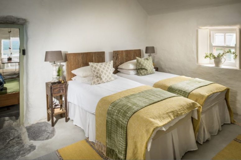 The beds and bedside tables are rustic and vintage at the same time