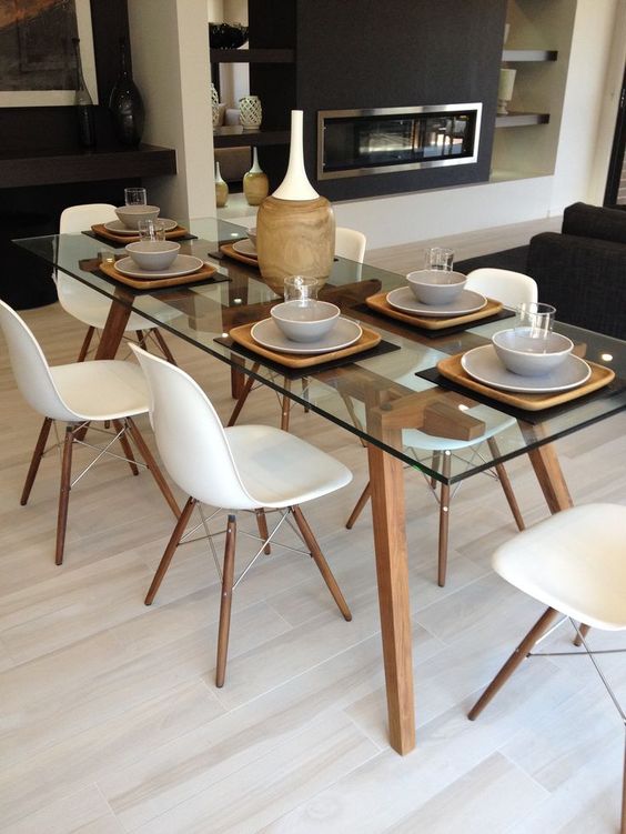 a chic modern table with wooden legs and a frame looks both modern and rustic