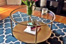 10 an elegant round copper and light wood and glass table with two tabletops for storage for a girlish space