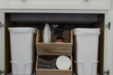 10 pull out trash cans in the sink cabinet won’t take much space and will be hidden to to spoil the style