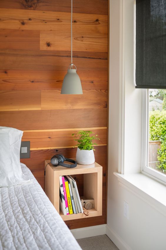 an open wooden box storage shelf for bedside storage