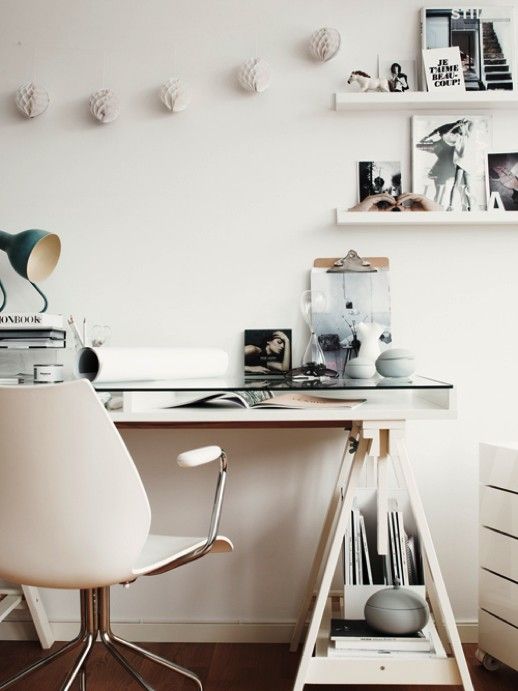 a storage space between two tabletops is used for magazines and books