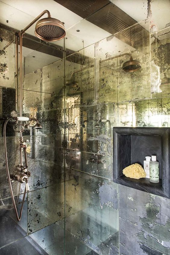faded mirror shower walls will make it refined, and copper fixtures add chic