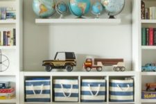 13 insert fabric boxes into an open shelving cabinet to declutter the space