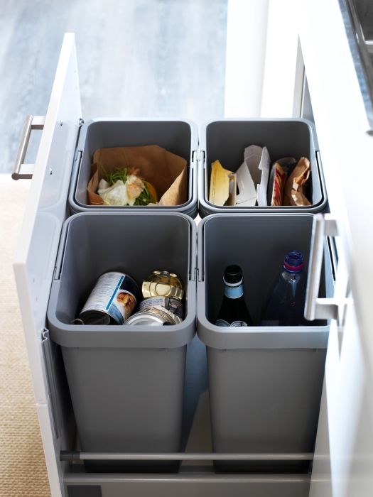 pull out separate trash bins inside a drawer for a modern kitchen