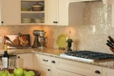 13 shiny mother of pearl backsplash tiles for sprucing up a creamy kitchen