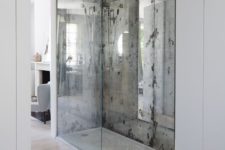14 two silver faded mirror shower walls highlight this space and make it more special