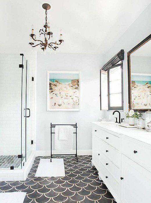 black fishscale tile floor creates a bold accent in this bathroom