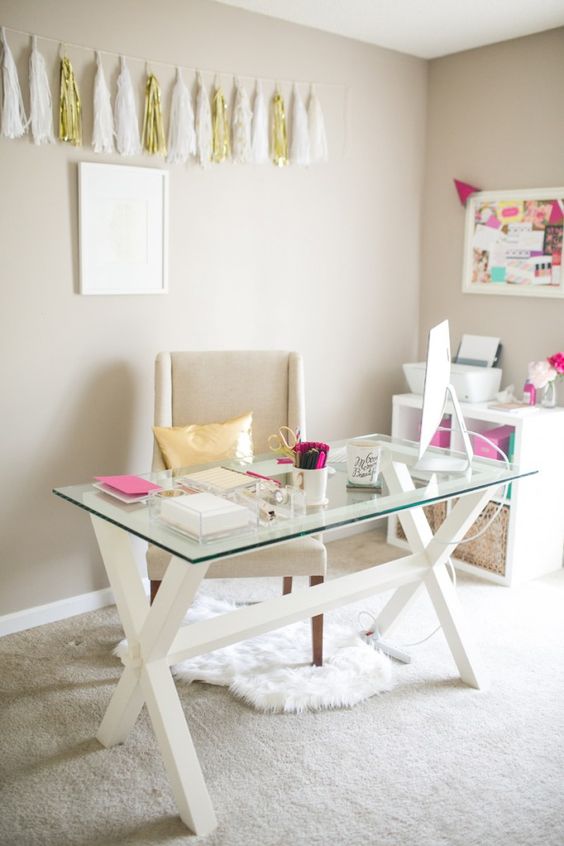 glam girlish home office with a trestle wooden leg desk and a glass tabletop for a modern modern feel