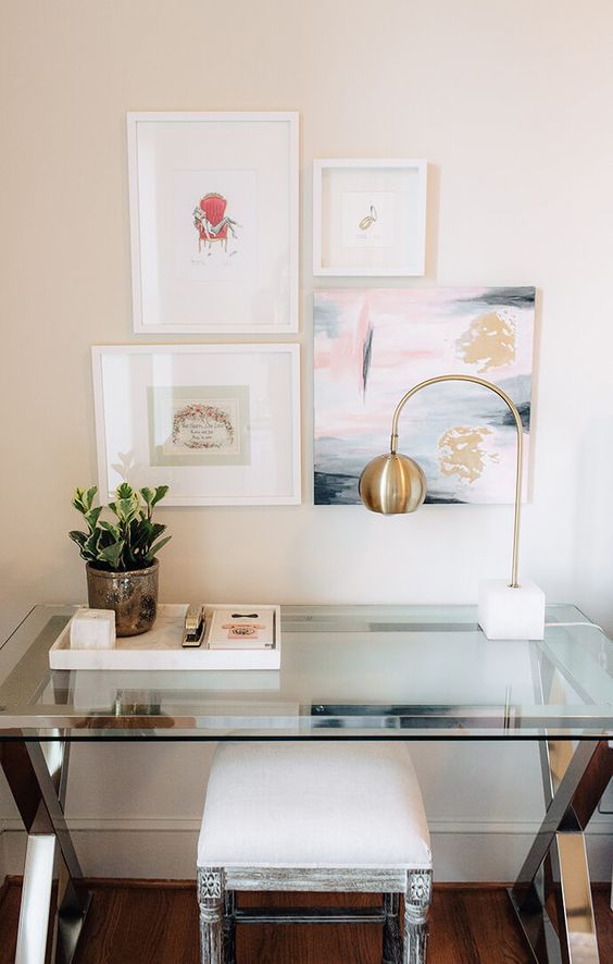 nickel framing and trestle legs with a glass tabletop and a vintage stool with creamy upholstery for a girlish space