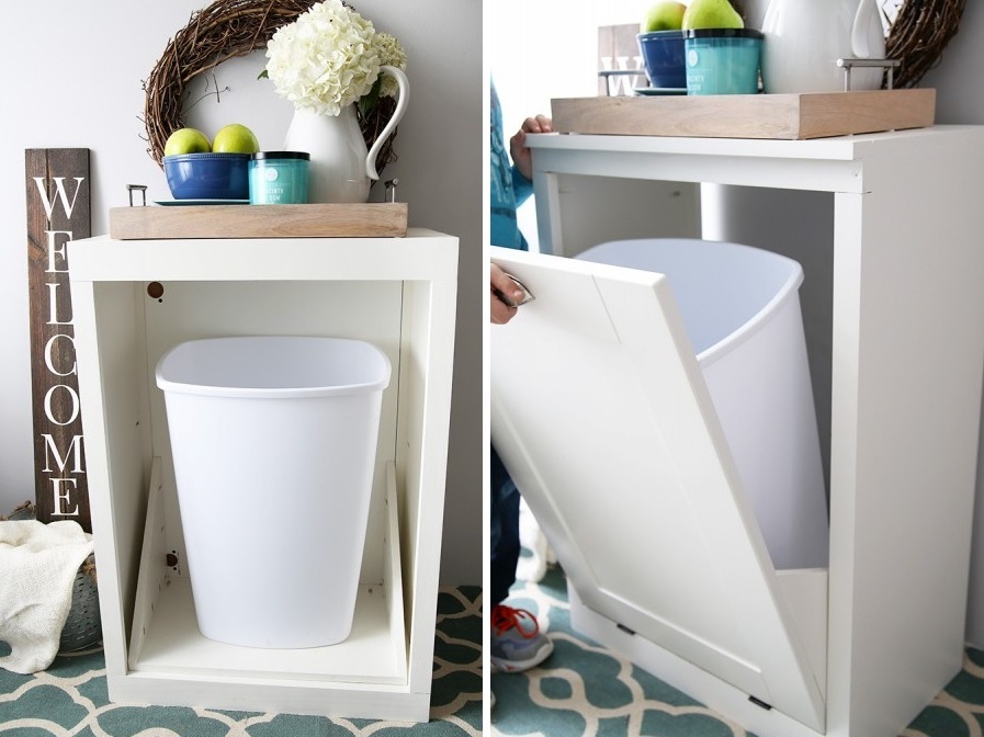a simple white tilt out cabinet for hidhing your trash can inside