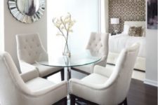 18 glam timeless dining area with dark wooden floors and matching chairs with white upholstery