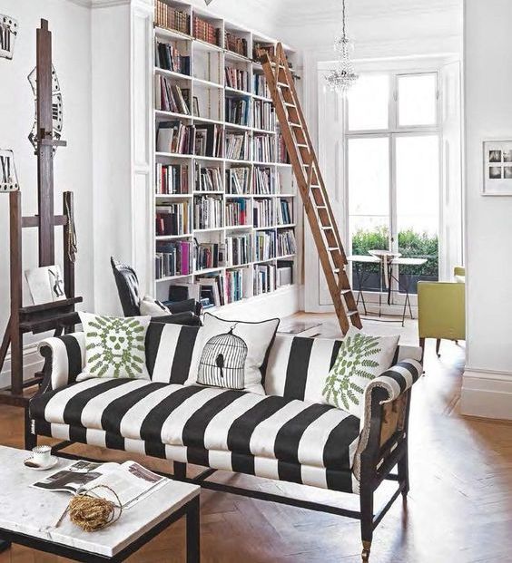 make a white space more eye-catchy with a striped black and white sofa