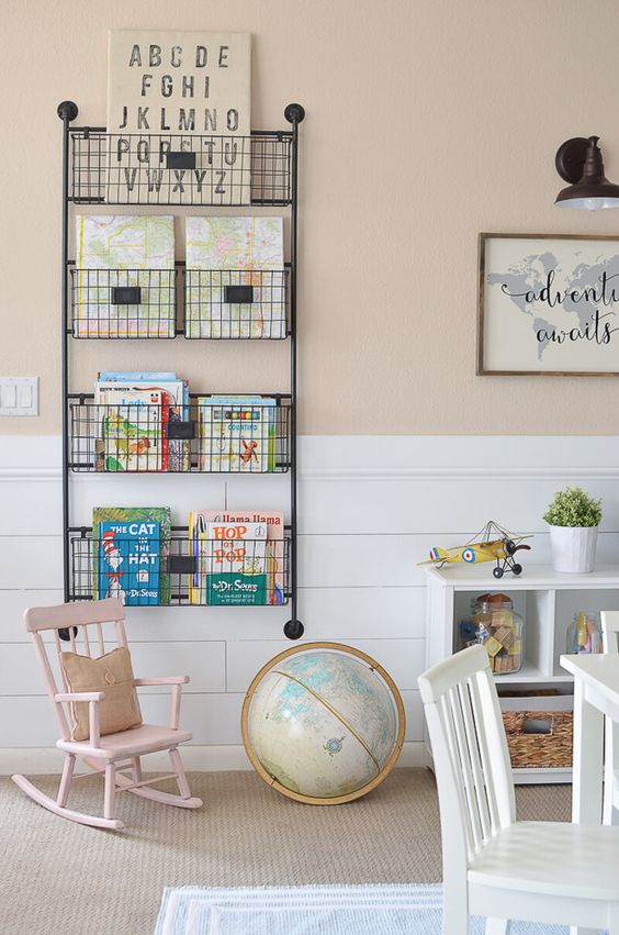 a metal shelf on the wall for storing books and other stuff is very comfy
