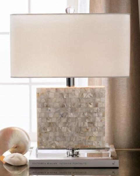 a modern lamp with a base incrusted with mother of pearl looks chic and beautiful