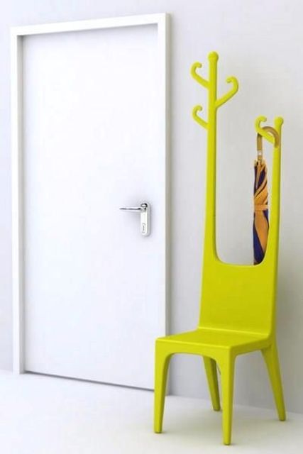 a neon yellow chair with incorporated coat hangers for a modern entryway