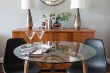 21 a small round table with wooden and metal legs and a glass tabletop for a cozy dining space or breakfast nook