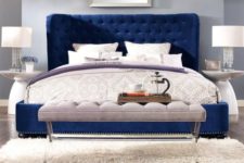 25 a navy velvet upholstered sofa makes a bold statement in a neutral bedroom