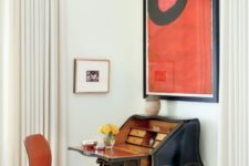 25 a vintage secretaire in a mid-century modern space with a bold artwork