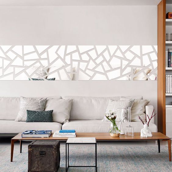 a modern geo mirror wall decal over the sofa for a modern feel