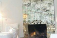 26 highlight the fireplace with a faded mirror cover to make it stand out in a refined way