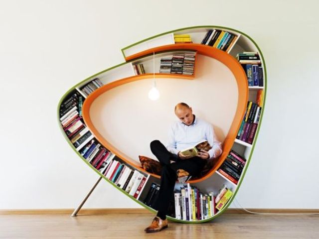 a dynamic bookshelf with a seat inside and an additional light bulb for every book lover