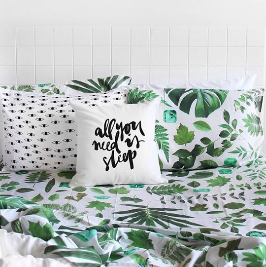 bold green leaf printed bedding for a modern summer bedroom