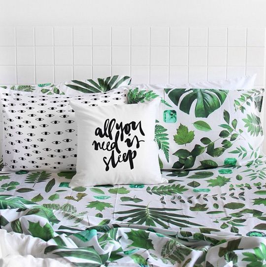 bold green leaf printed bedding for a modern summer bedroom